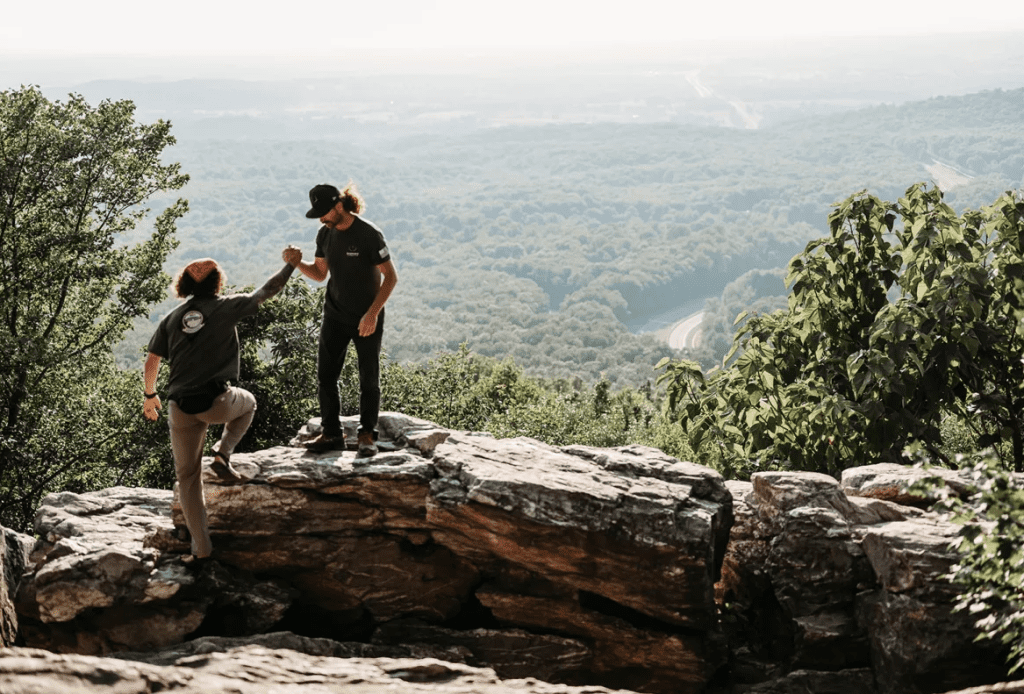 Man helping friend up